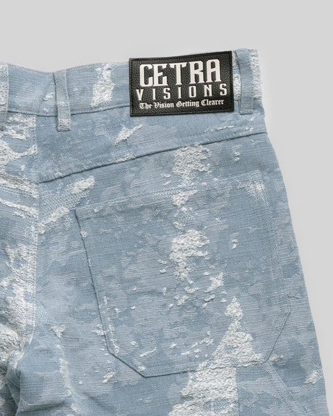 DISTRESSED DENIM PANTS